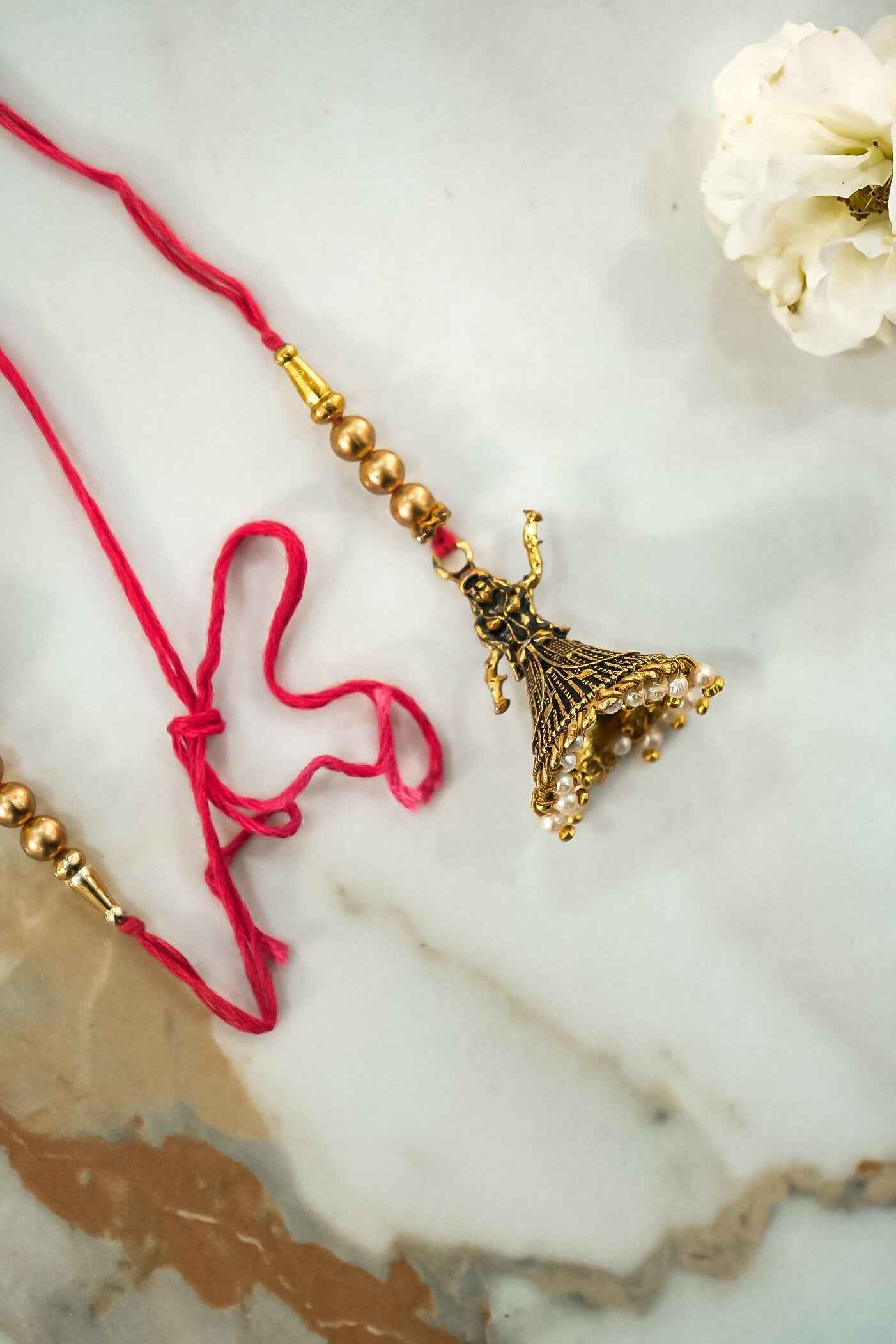 Elegant Dolls & Pearl Hanging Lumba Rakhi for Bhabhi – Traditional Rakhi Design by Upharkaro-Upharkaro