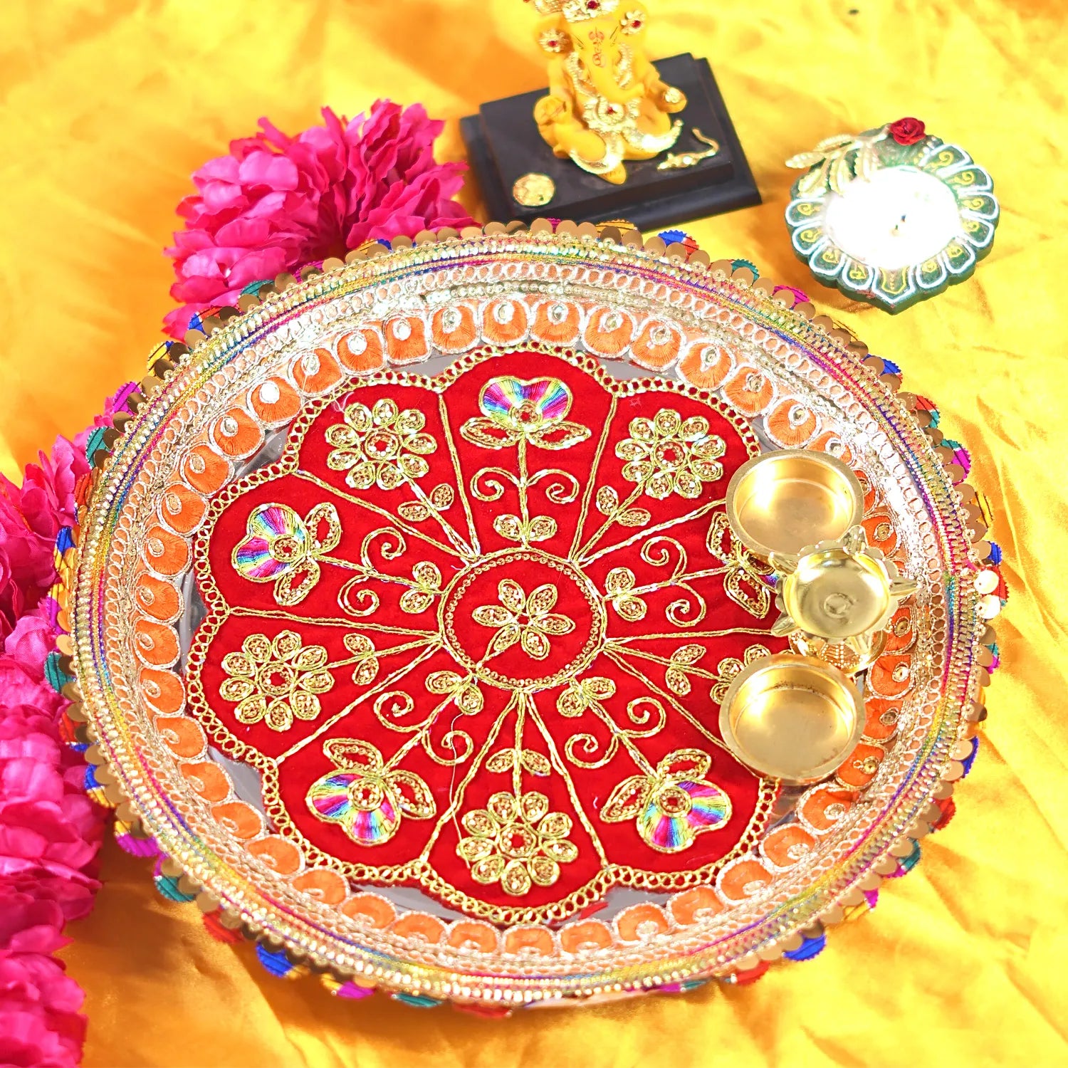 Decorative plate with gold and red design on a yellow background